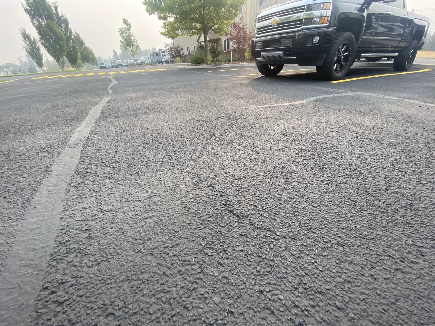 Parking Lot Resurfacing Services Compared with Full Pavement Replacement